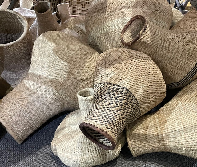 Traditional handmade Mbinga Gourd Pots in natural woven designs.