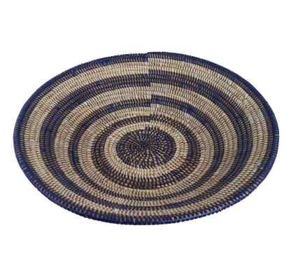 Medium African decor basket in blue and beige with intricate patterns.
