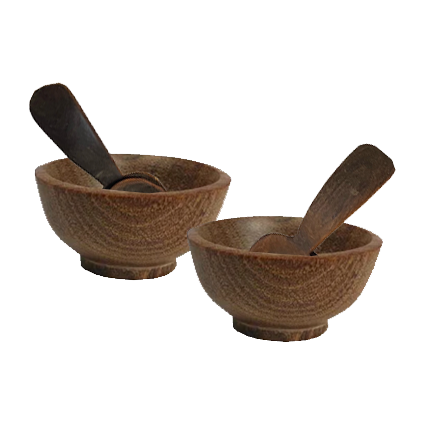 Dark wood condiment bowls with matching spoons, ideal for serving salt, pepper, and seasonings.